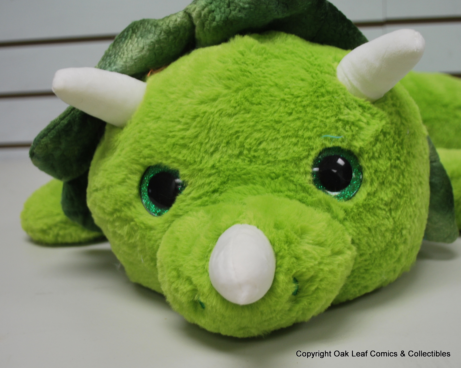 large green stuffed dinosaur